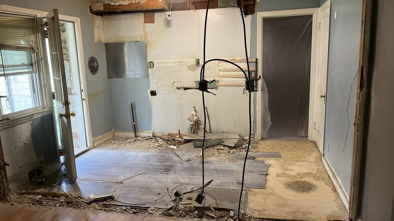 Kitchen taken down to the subfloor during demolition