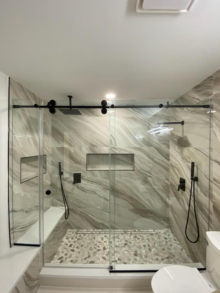 Large format stone shower surround detail