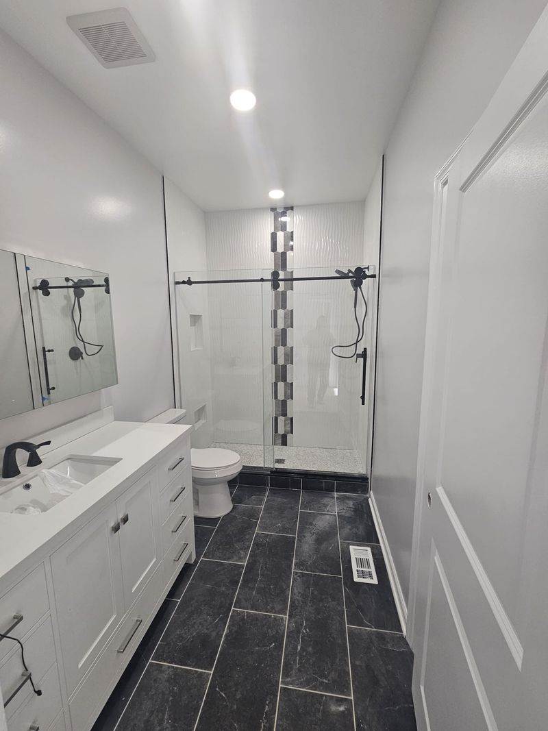 Long double vanity in a bright, practical bathroom